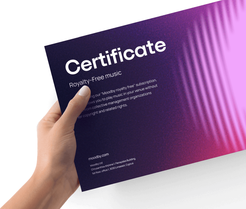 Hand holding a Moodby royalty-free music certificate